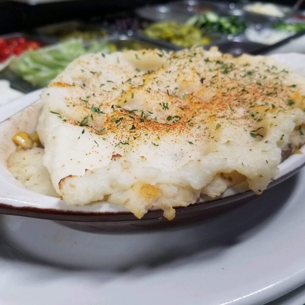 Baked mashed potato casserole with herbs